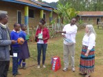 Distributing pencils and a soccer ball